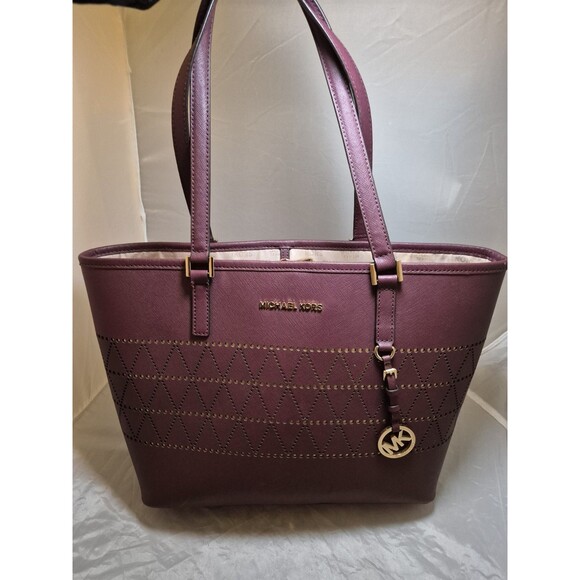 Michael Kors Handbags - Michael Kors Jet Set Travel Tote Maroon With Gold Laser Cut Design Large Tote